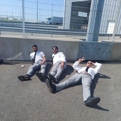 Our Drivers doing a trip back to France and stuck at the Calais port trying to clear immigration- having a well deserved sun break whilst the authorities try to clear a back log of 200 coaches .